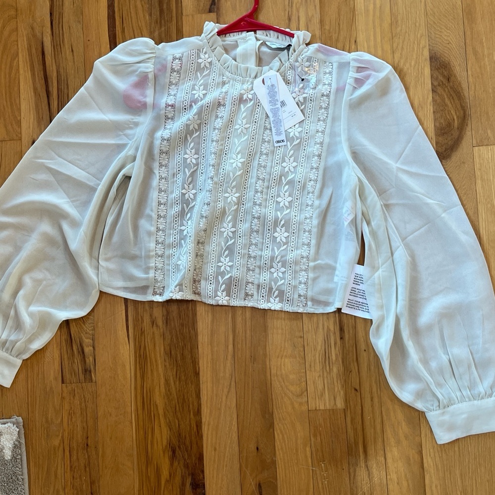 Embroider flowy blouse, Off white color, and Still has tags.